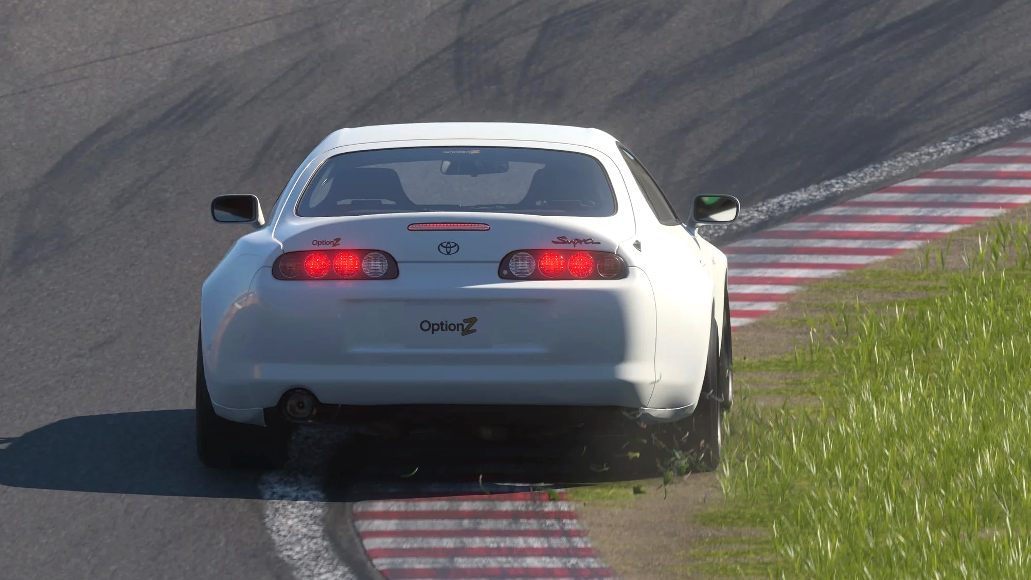 OptionZ Supra attacks the braking zone of Tsukuba's first hairpin