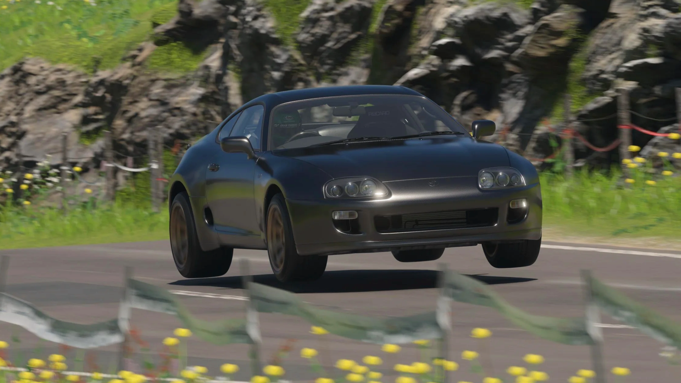 OptionZ Supra flying over a jump