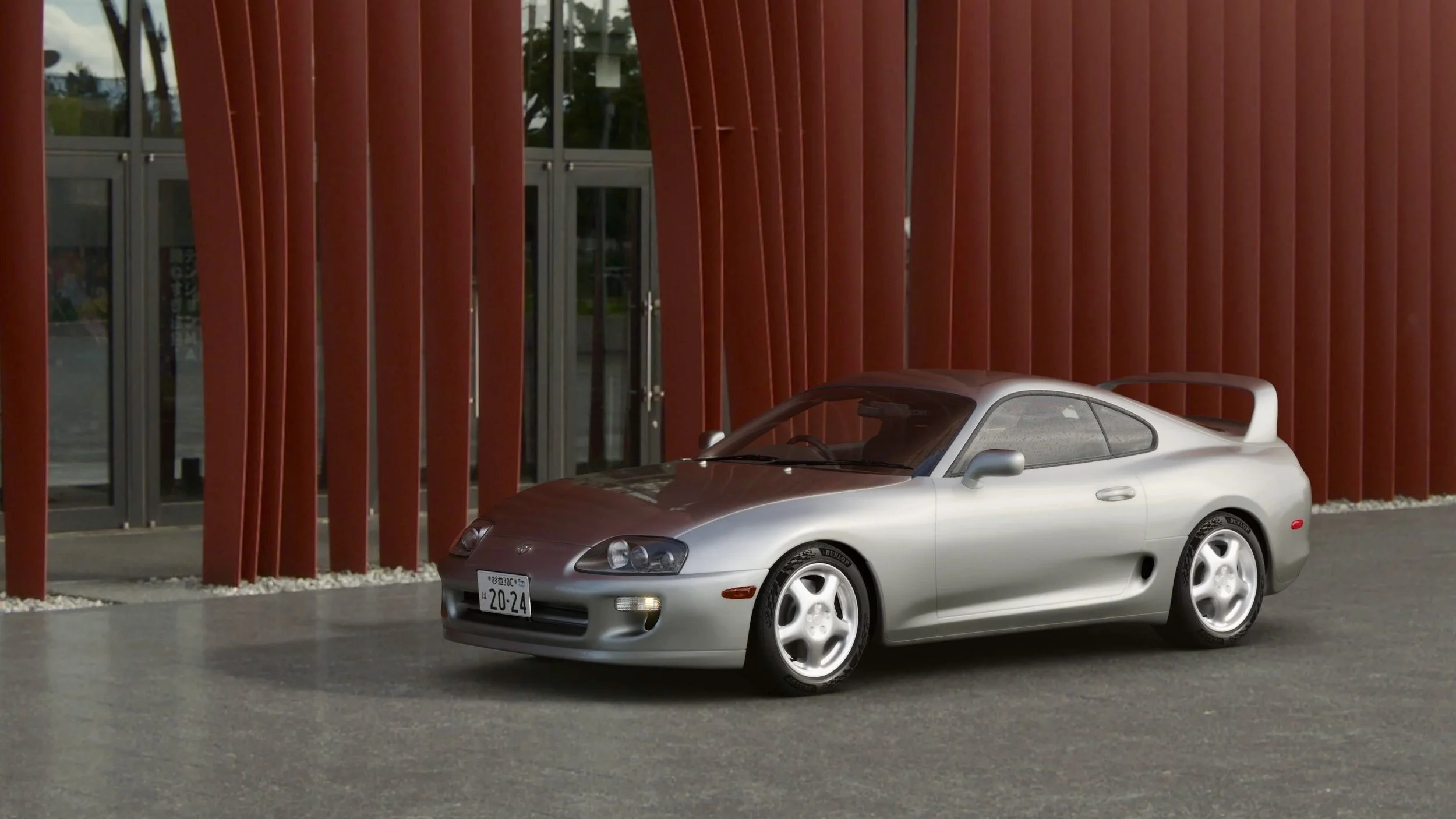 A Toyota Supra parked at an Art Museum in Aomori