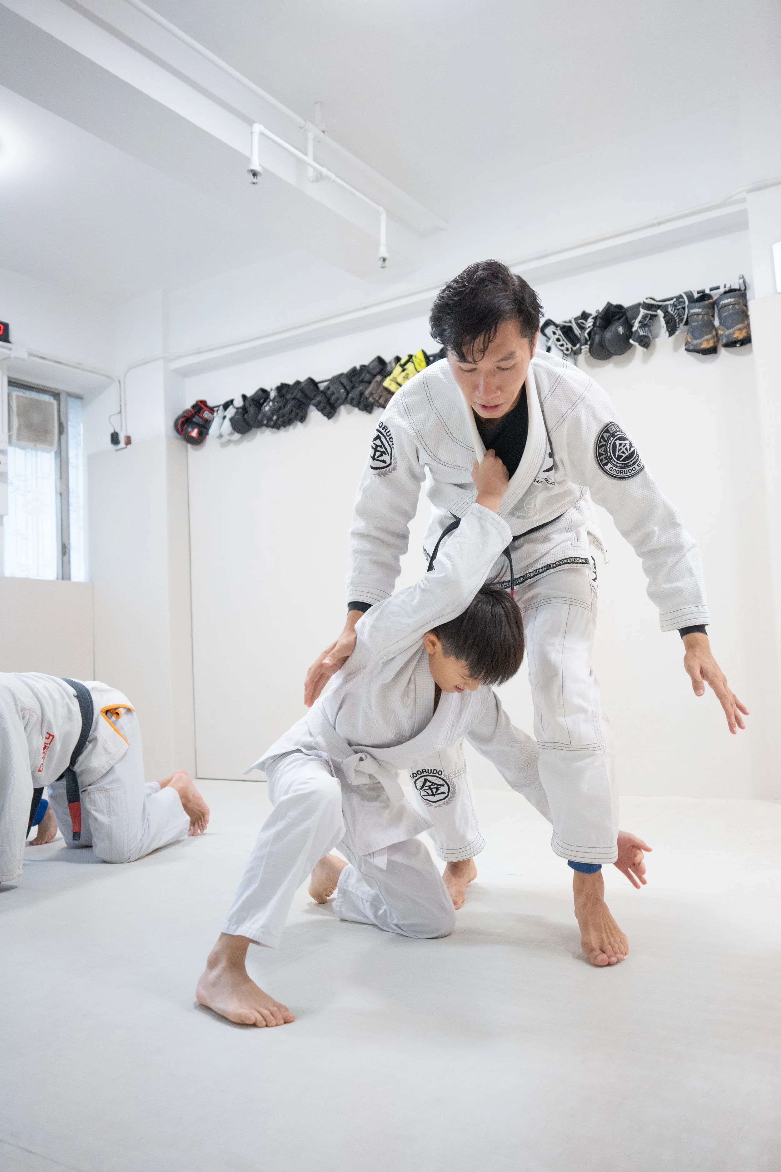 a 4 years old girl practicing Kid Brazilian Jiu-Jitsu.