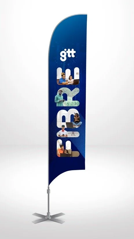 A blue vertical banner with the BTG logo and five cut-out sections showing people using laptops and tablets.