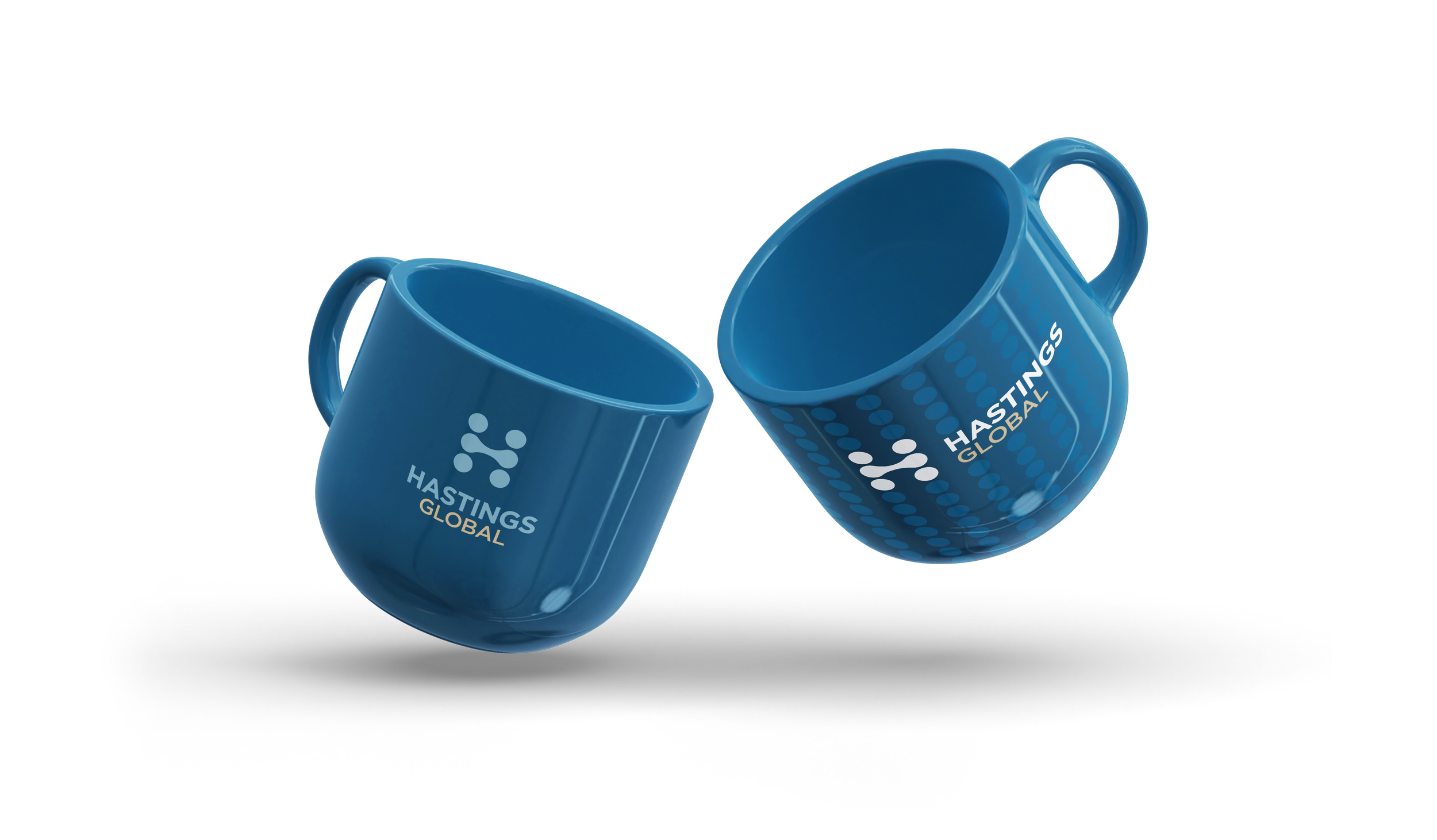 Two blue Hastings Global coffee mugs with white and blue logo, positioned to clink against each other.