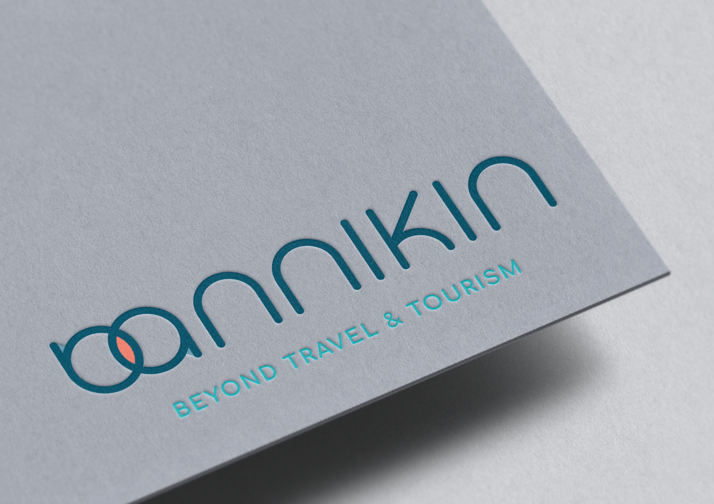 A business card for Anamik with the tagline 'Beyond Travel & Tourism' and a logo featuring overlapping circles.