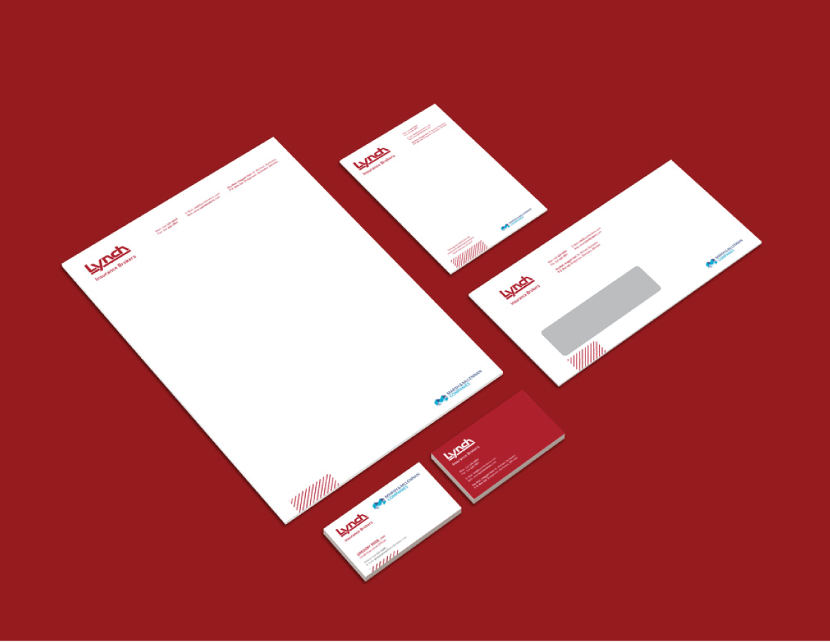 A collection of Lynch stationery, including letterhead, envelopes, and business cards, arranged on a red background.