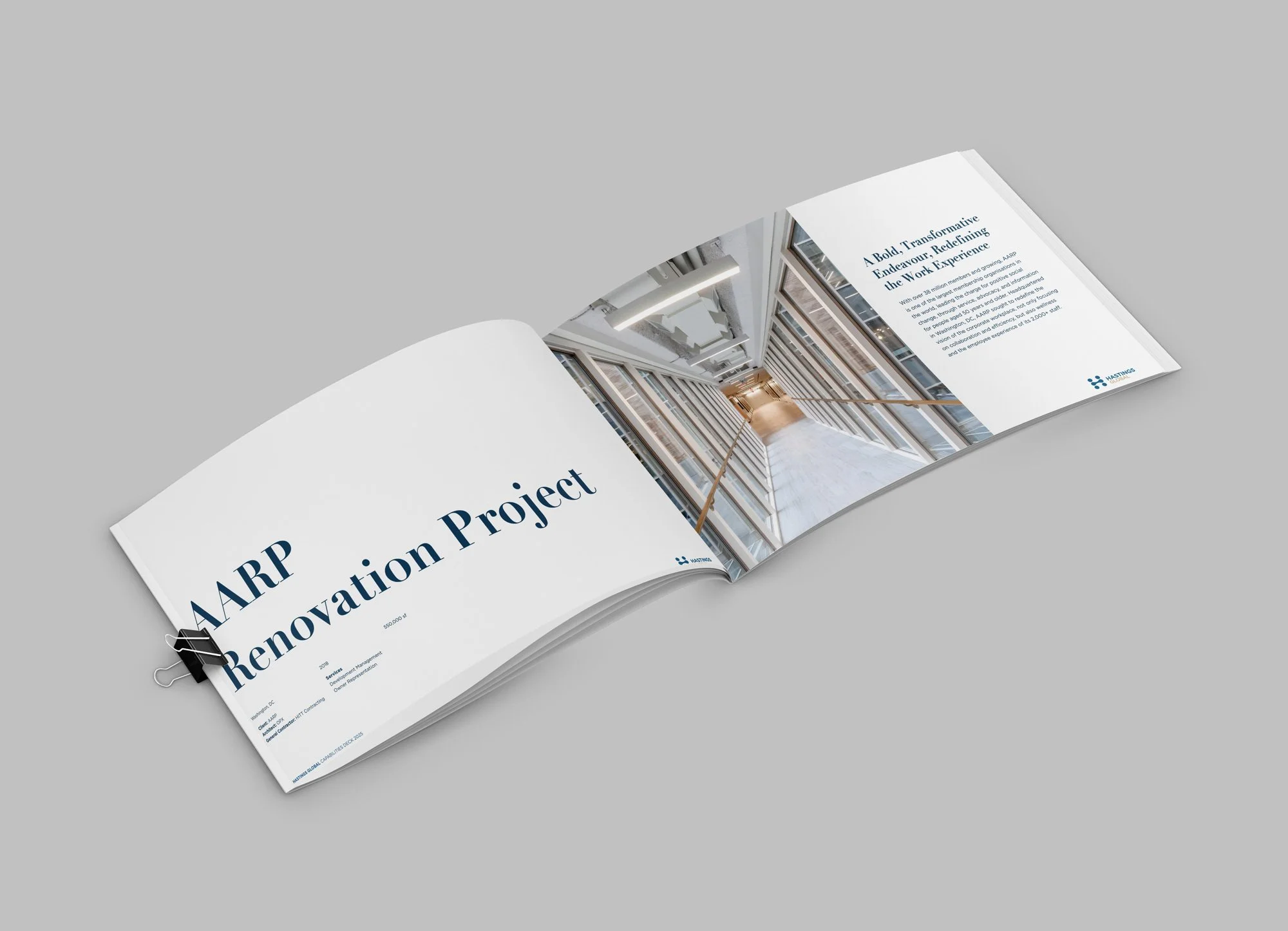 Open brochure for ARP Renovation Project featuring a corridor with large windows and wooden handrails.