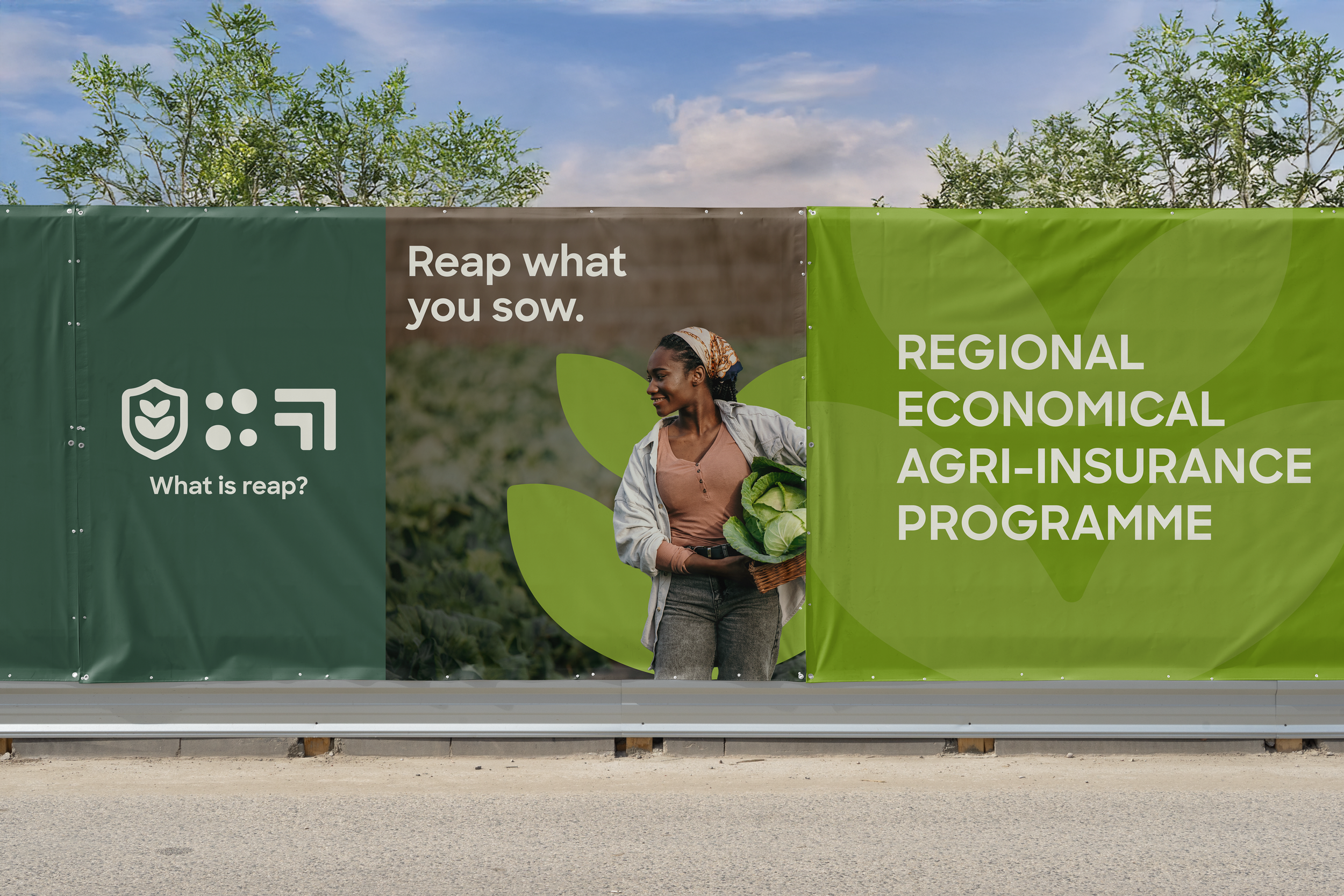 A promotional banner for a regional financial agricultural insurance program featuring a smiling woman holding lettuce in an outdoor farm setting, with a background of green trees and a partly cloudy sky.