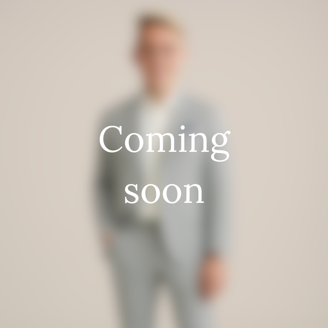 Blurry image of a person in a gray suit with text 'Coming soon' overlaid.