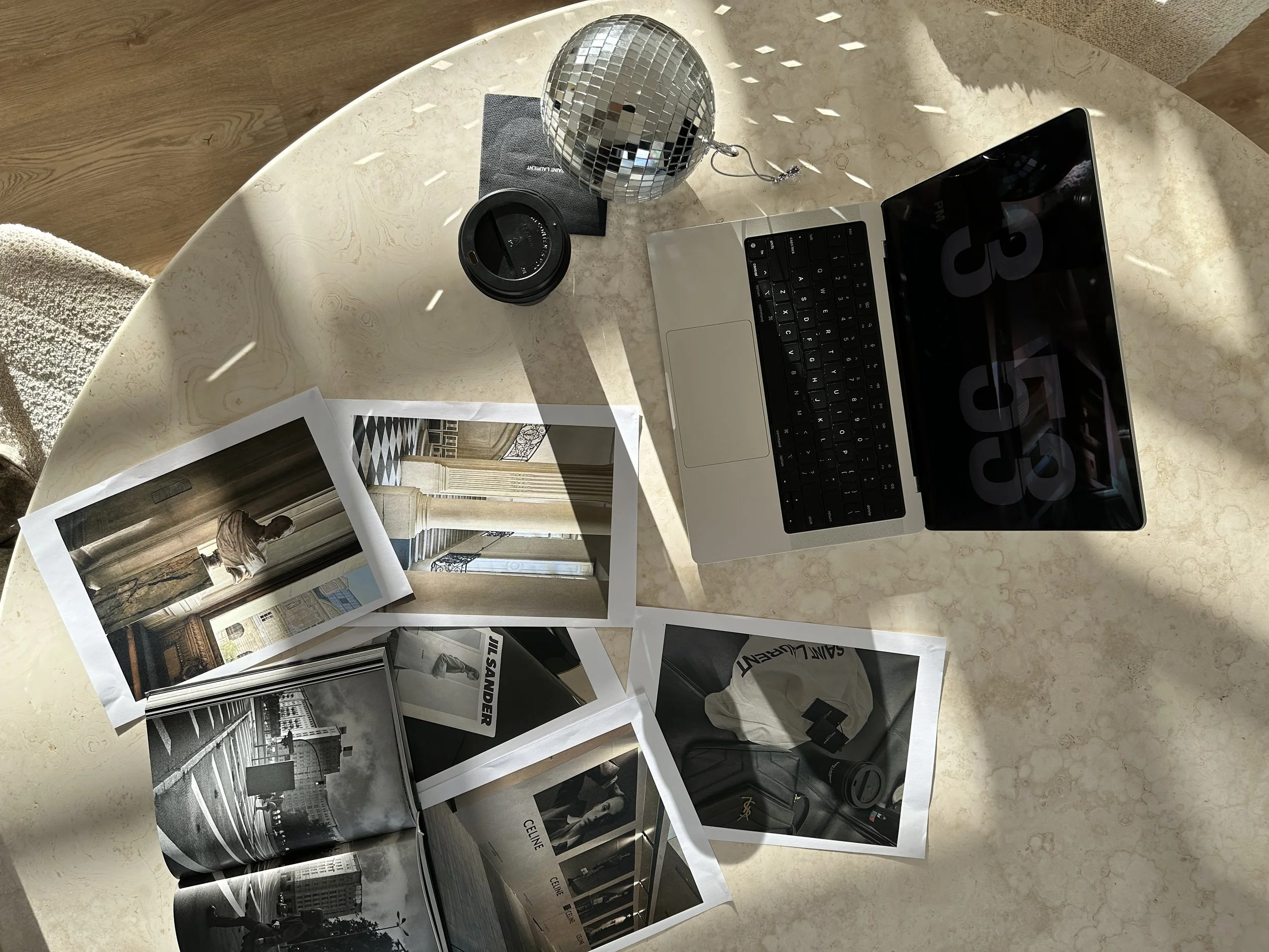 Table with photos and laptop