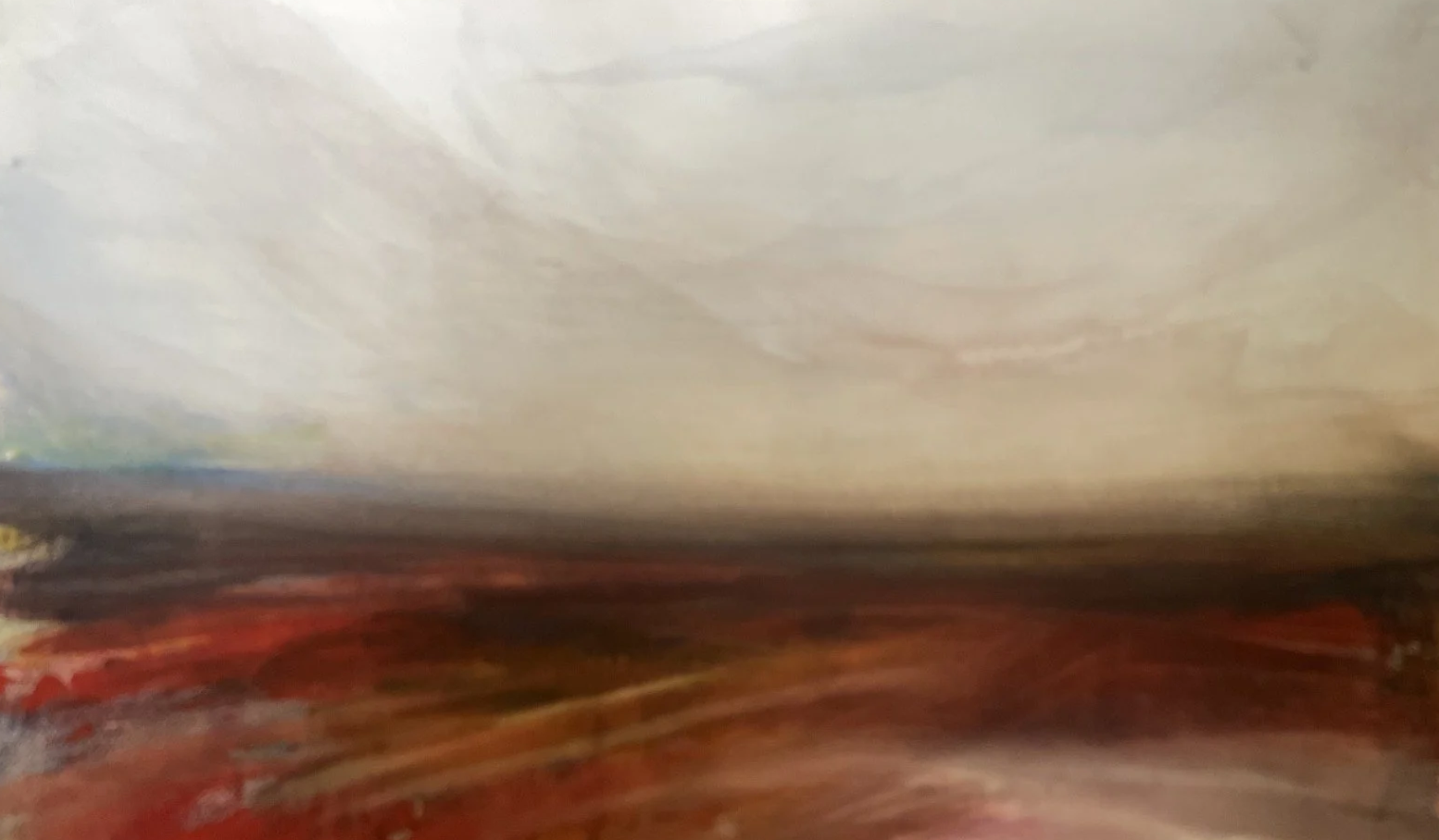Blurred abstract image with muted colors and indistinct shapes, possibly featuring a wooden surface.