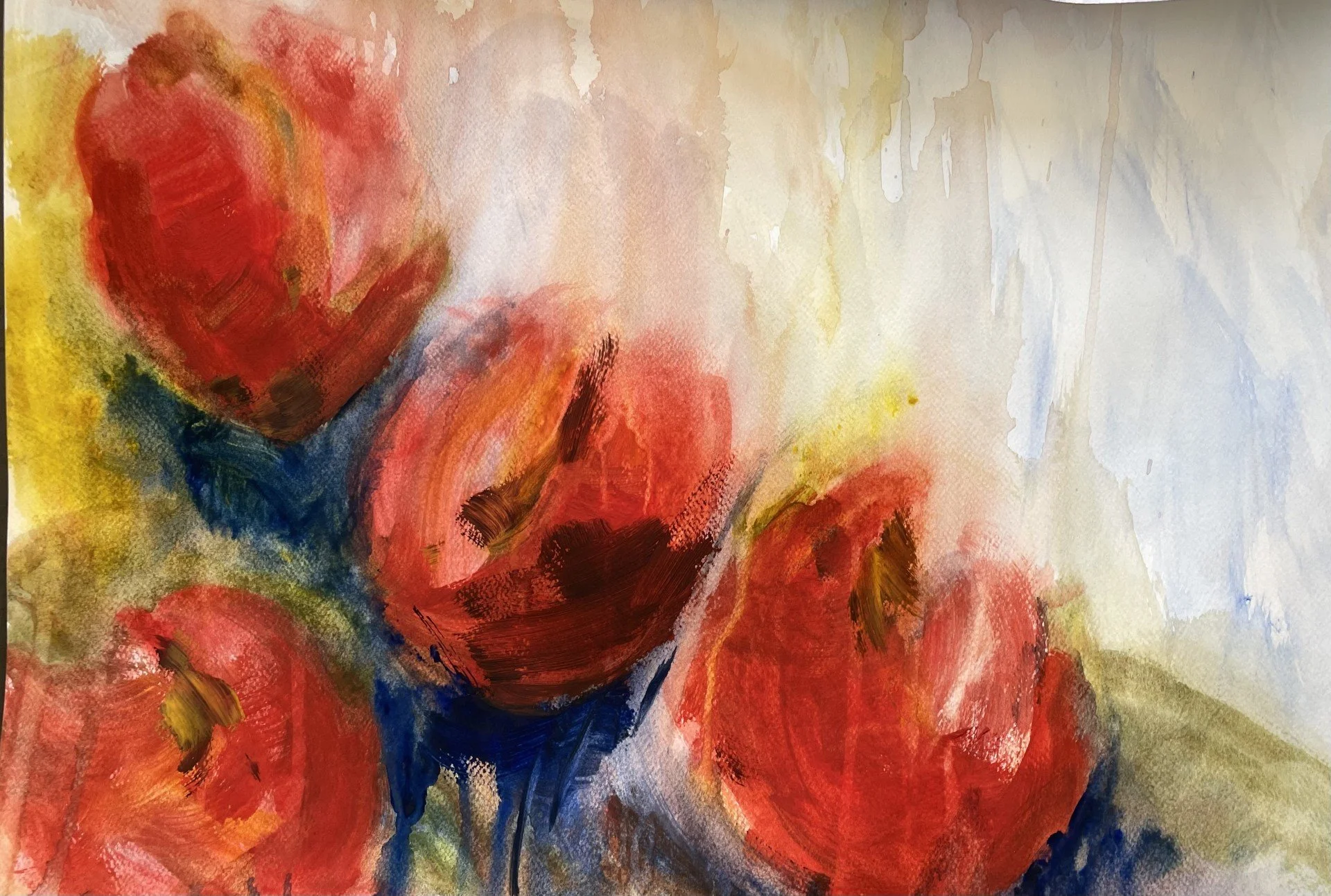 Abstract watercolor painting featuring warm red, orange, and yellow tones with hints of blue and green.