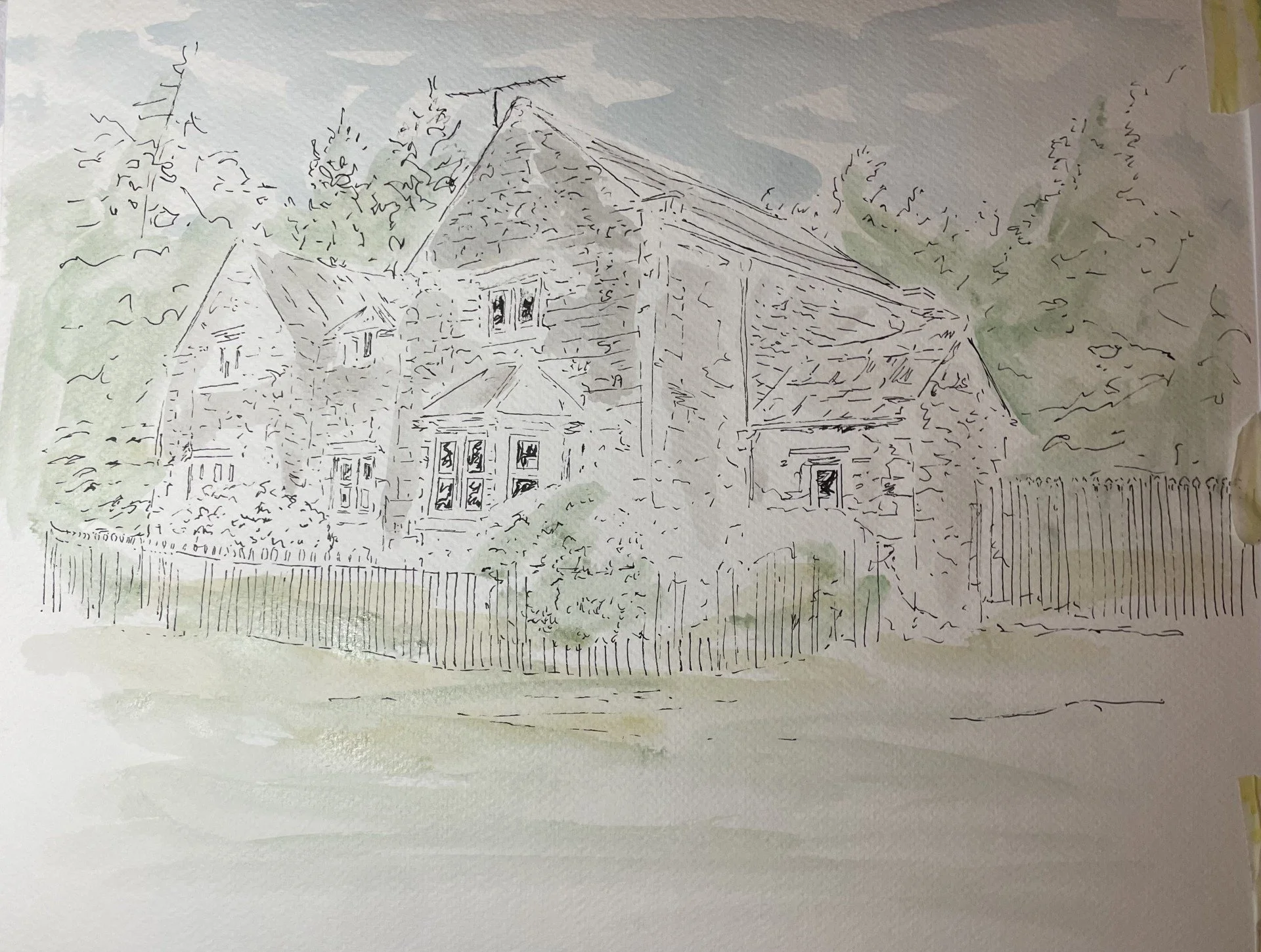 A hand-drawn outline of a two-story house with multiple windows, a gable roof, and surrounding trees, depicted on watercolor paper with faint green and gray watercolor washes.