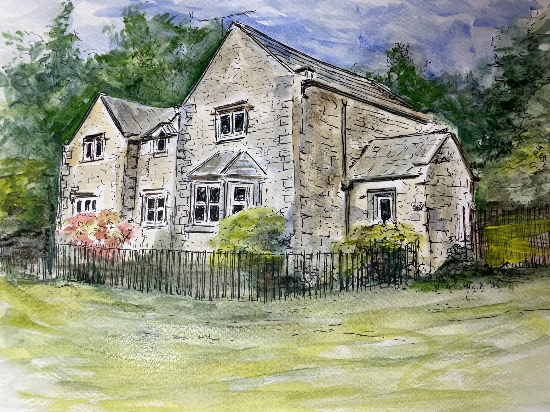 Watercolor painting of a large stone house with multiple windows, surrounded by a black picket fence, trees, and bushes, under a cloudy sky.