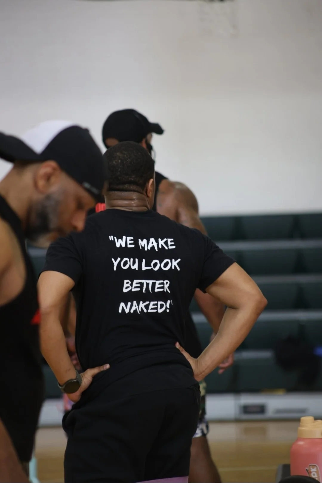 Participant wearing a Refreshed Fitness shirt during a group workout session