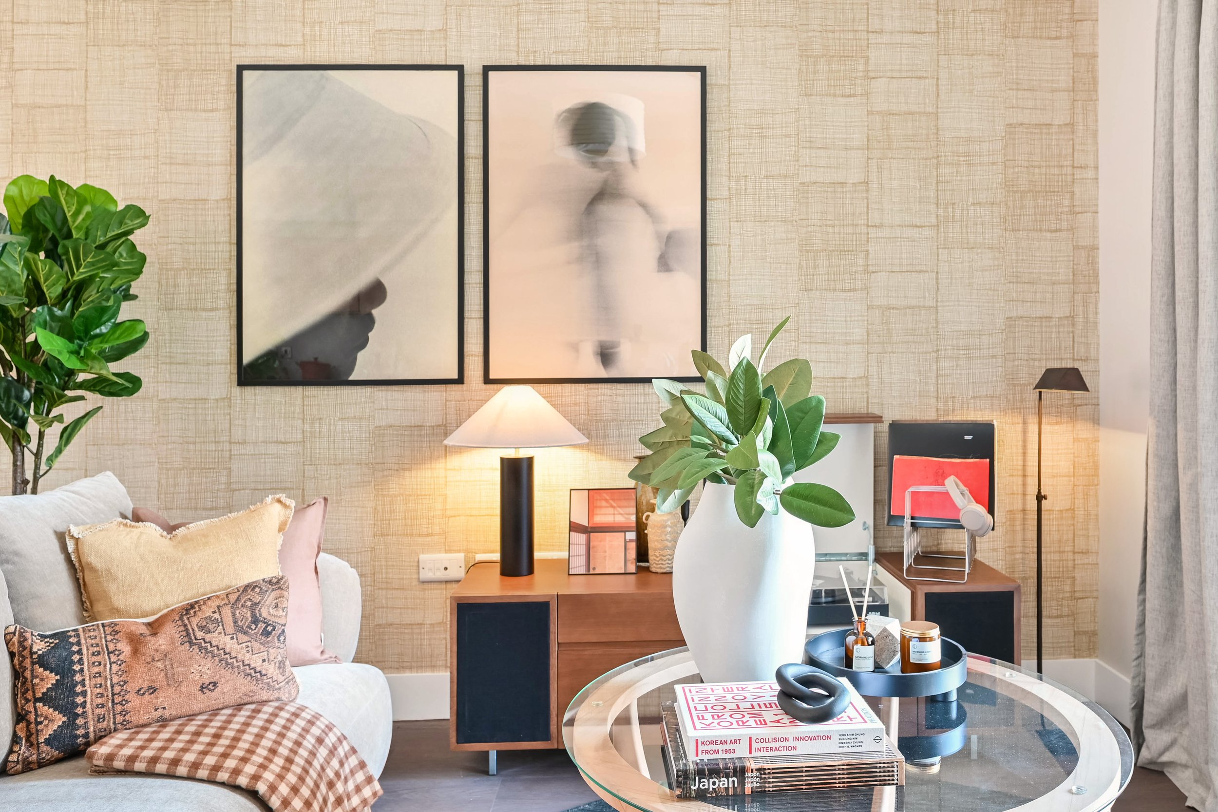 Large neutral pictures on a show home living room wall