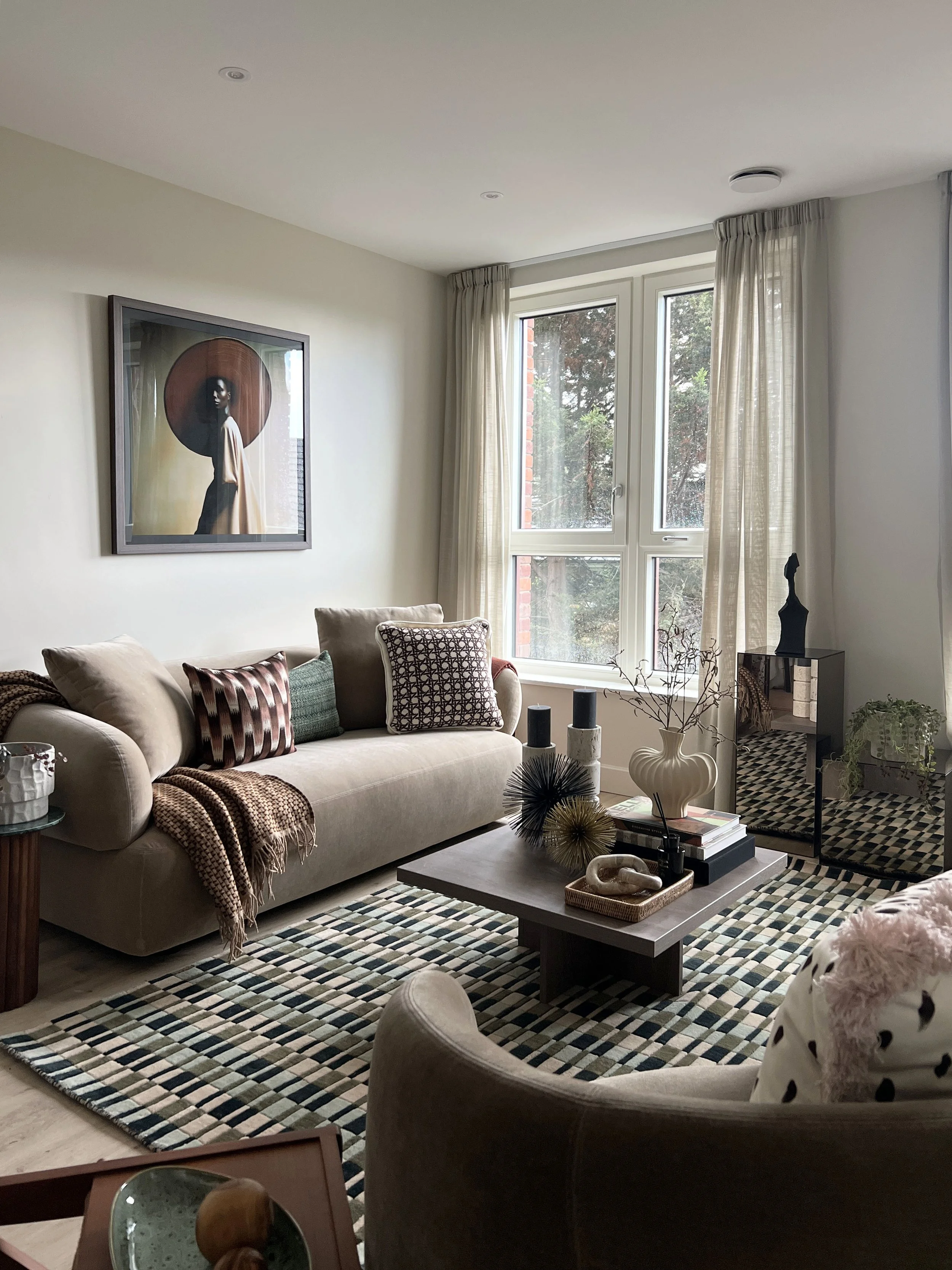 A fully furnished stylish show home living room with accessorised coffee table