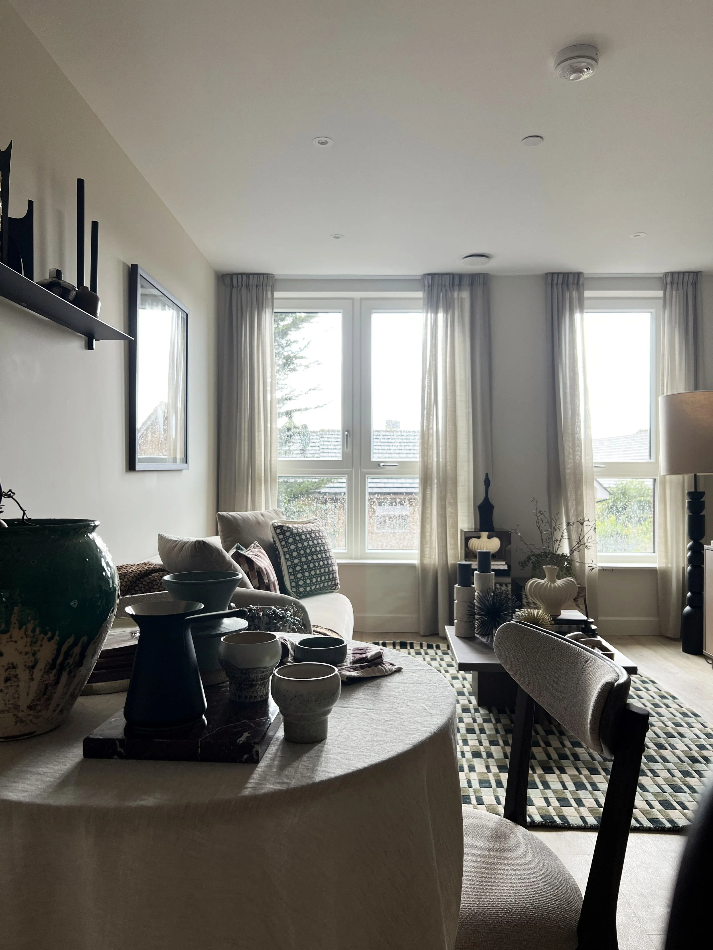 Light pouring into an eclectic show home dining space