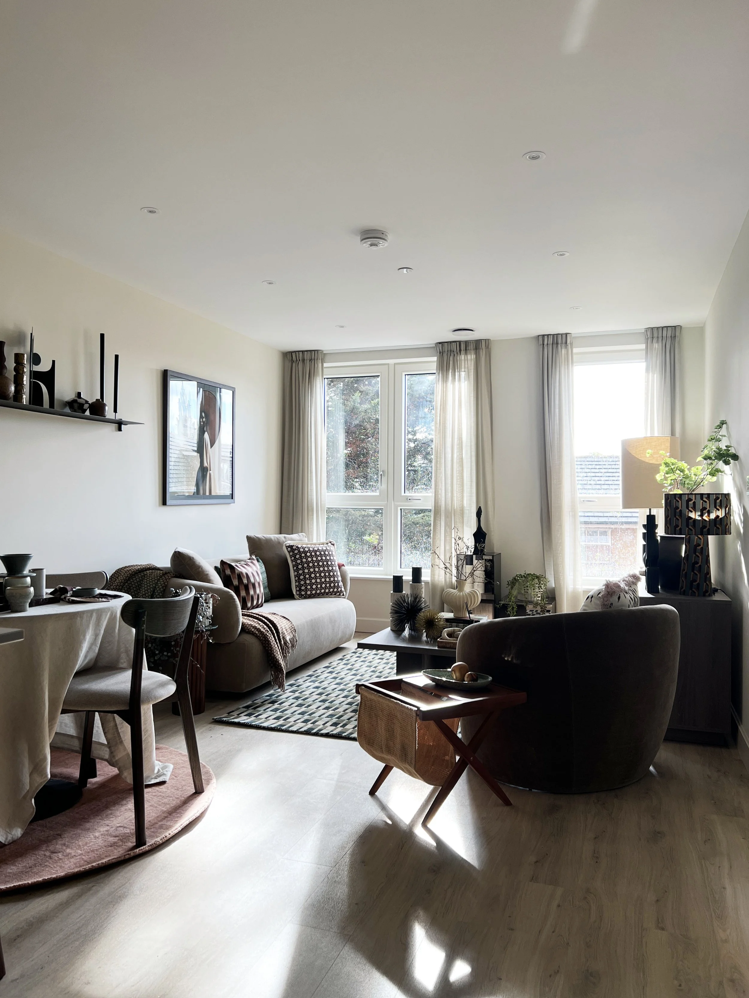 A beautiful airy and light show house living room that has been styed by an interior designer