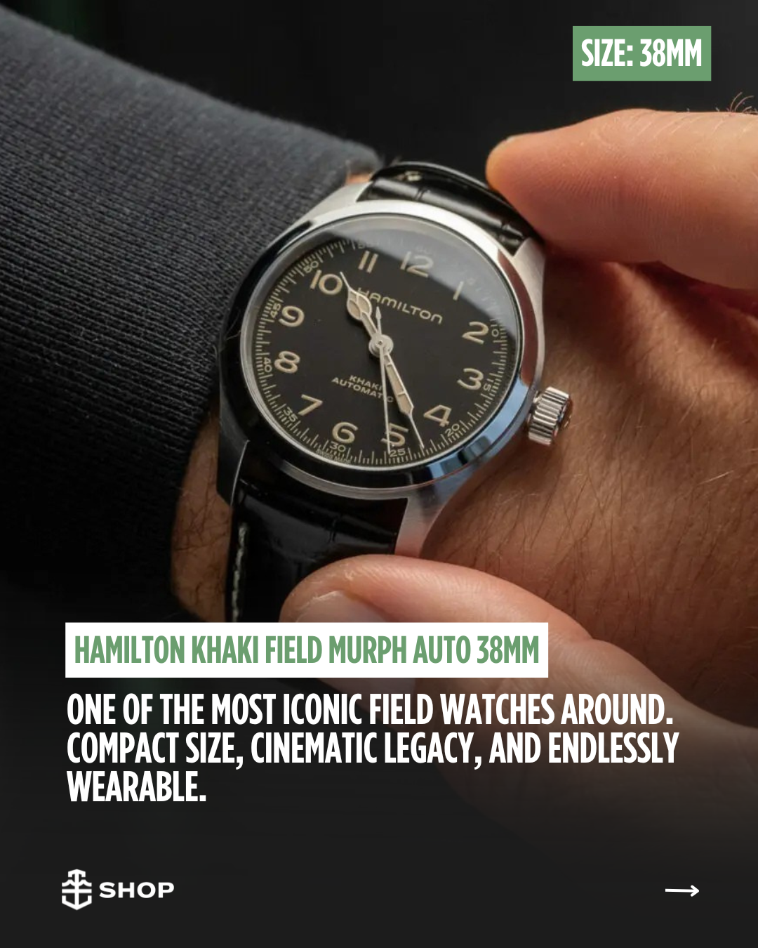 Close-up of a Hamilton Khaki Field Murph automatic watch with a black dial and cream-colored numerals, worn on a person's wrist. The watch has a leather strap and a chrome case.