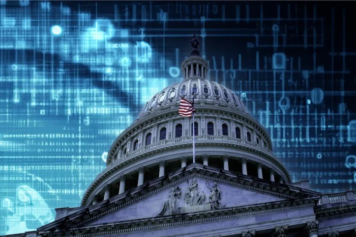 United States Capitol with a flag and blue background