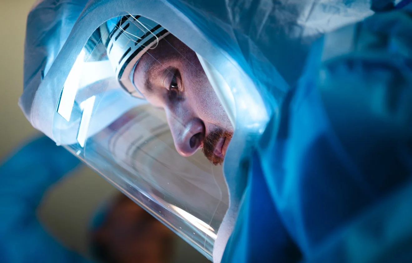 Colton in his COVID-19 (PAPR) powered air purifying respirator.