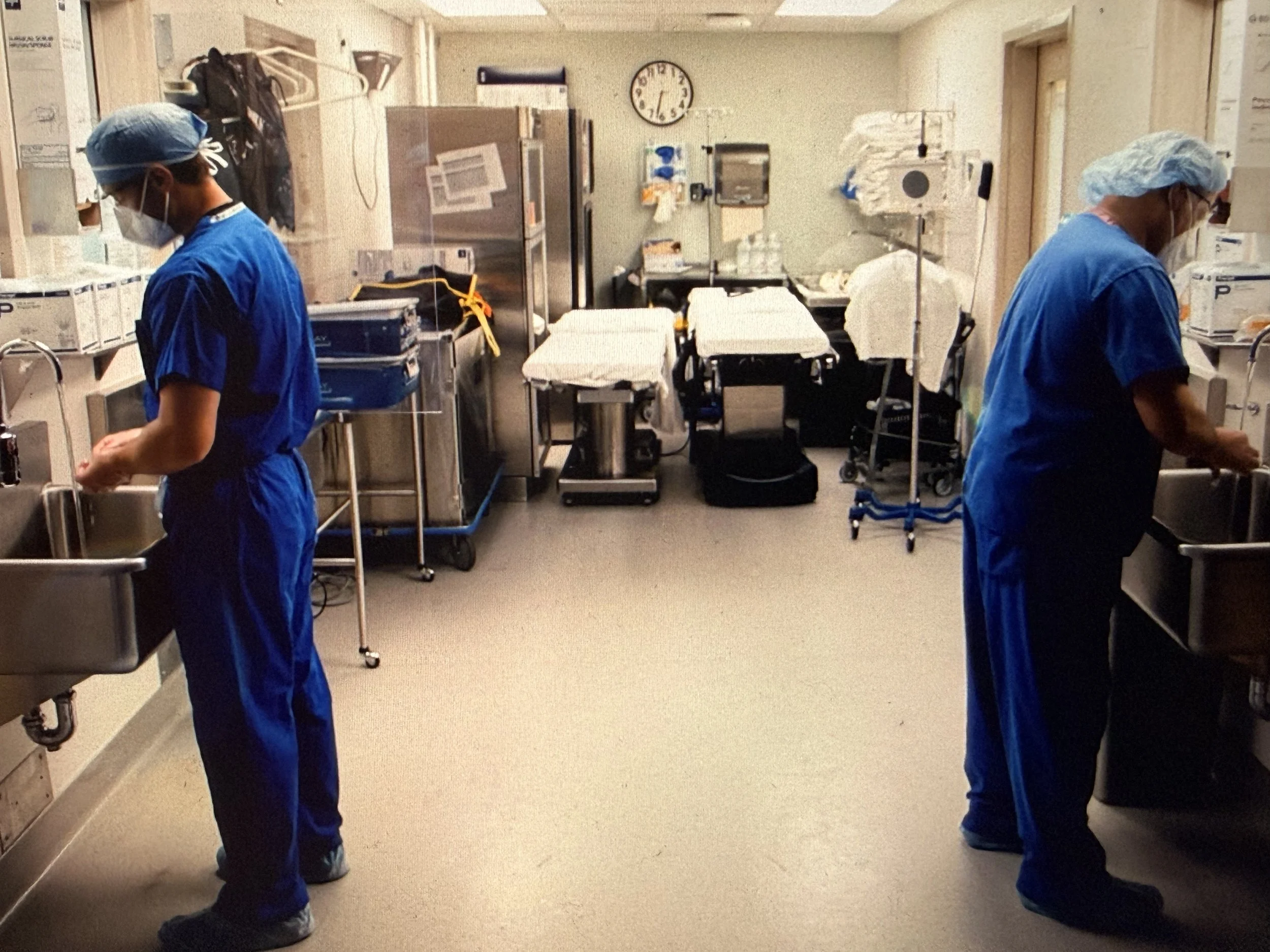 Dr. Noftz and Dr. Fuentes scrub for tracheostomy cases.