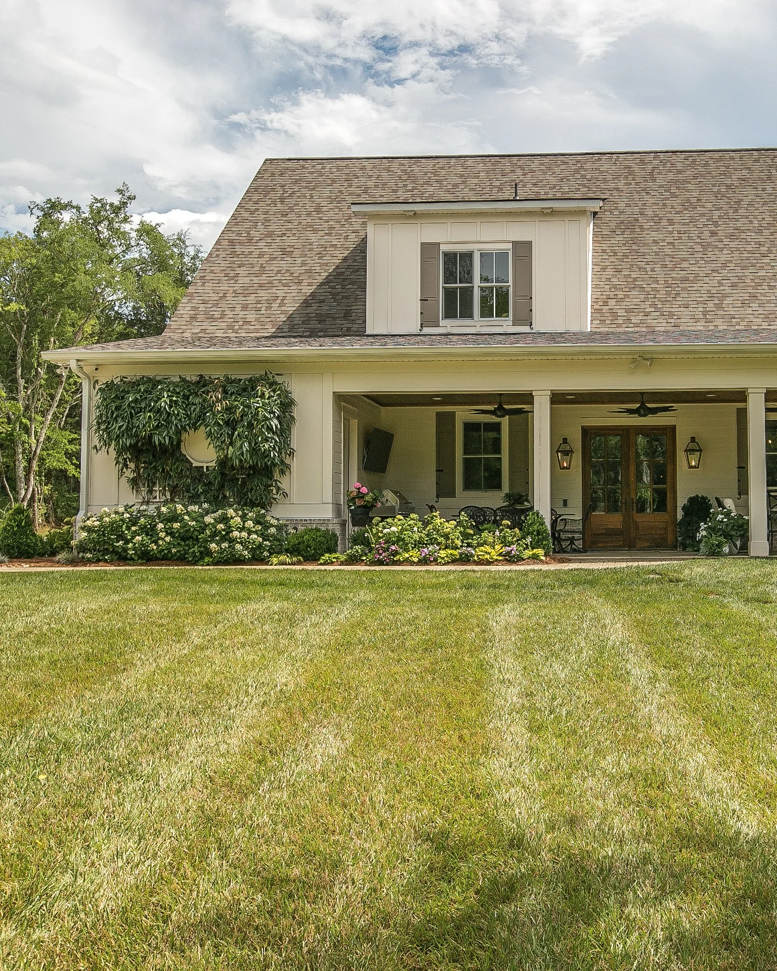 Cottage style done right, Every detail from the gas lanterns to the climbing vine was considered. This one feels like home the moment you pull up. 

#jtaylordesigns #customhomes #middletennessee
