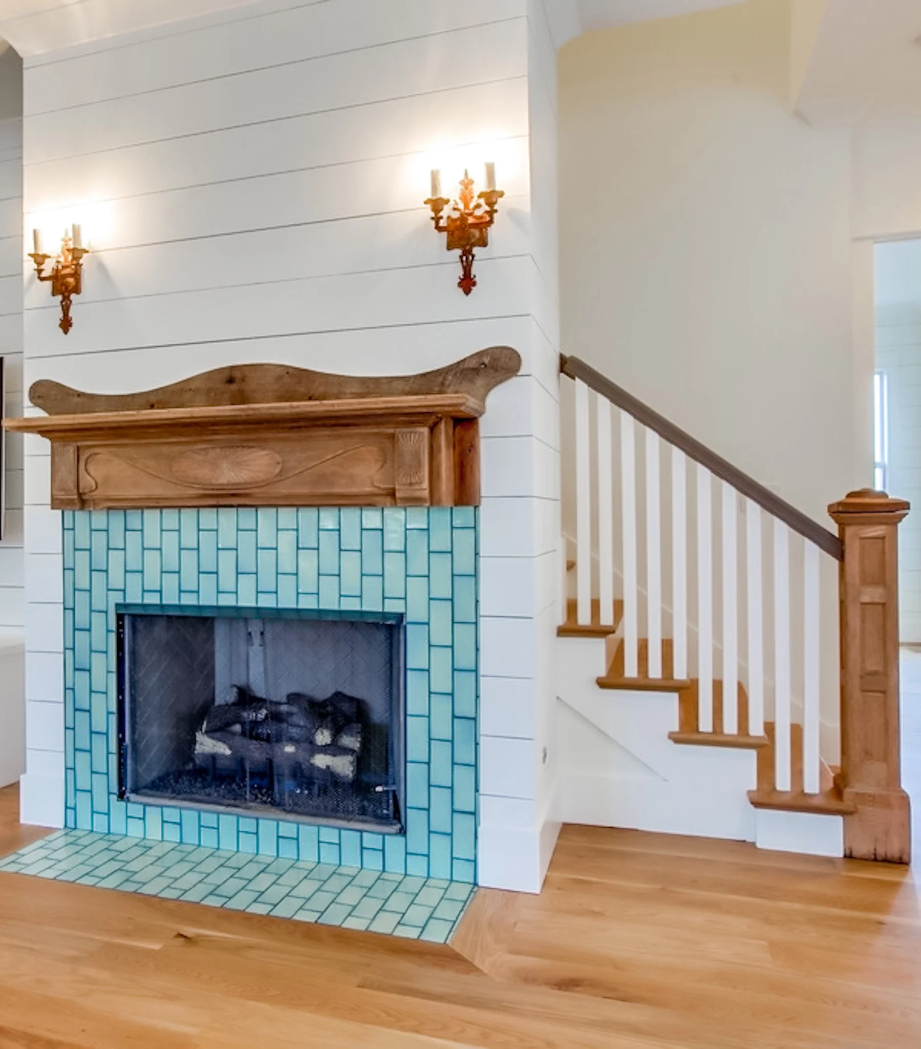 In a world where the TV usually wins, it's nice to see a fireplace that can stand on its own. No screen above the mantel, just beautiful tile, a carved wood surround, and a moment worth pausing for. This is what the heart of a home looks like. 

#jta