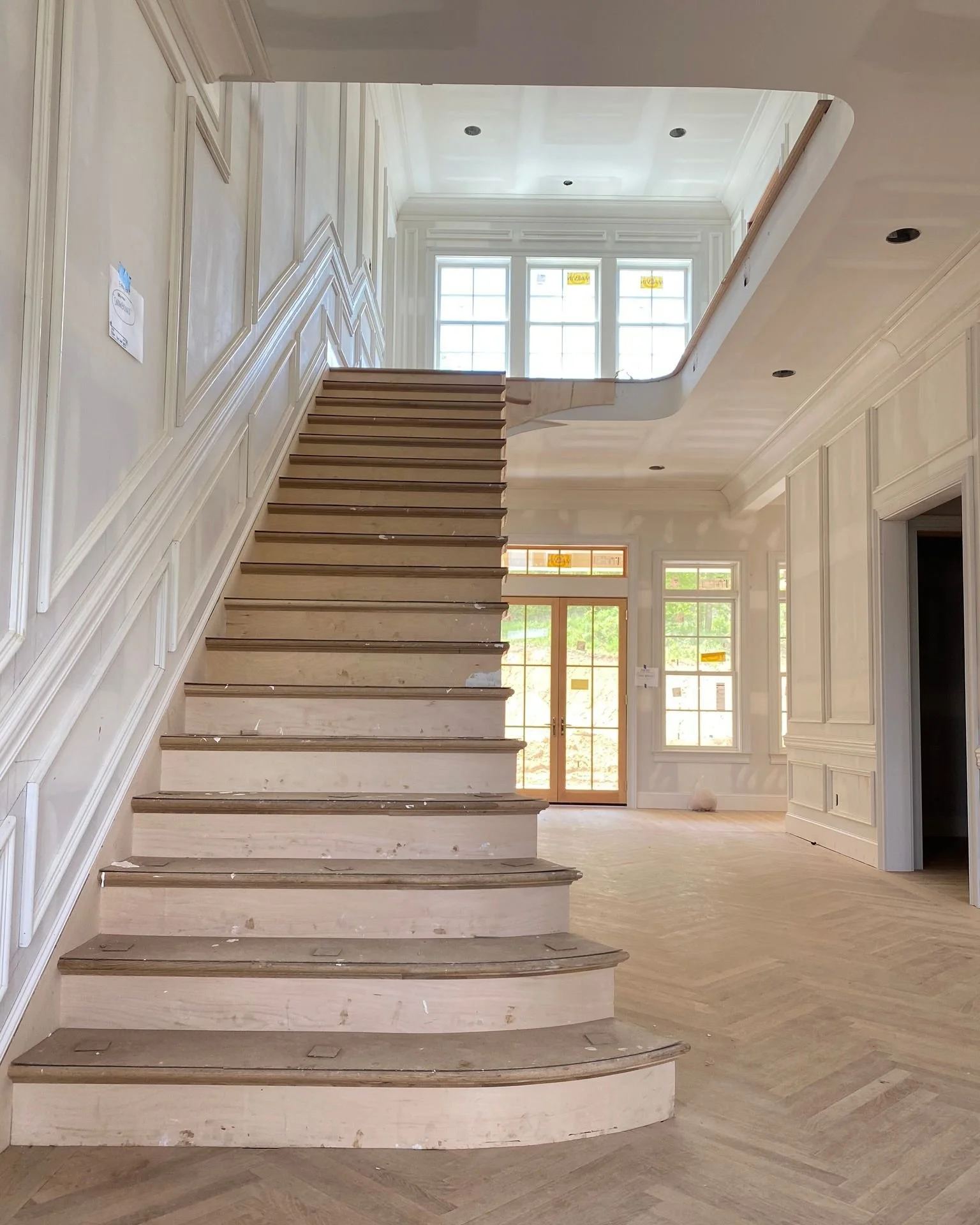 A foyer should do more than connect rooms. It should create presence the second you walk through the door.
This traditional entry was designed to pull your eye straight through the hall while the stair becomes almost sculptural overhead.
It is about 