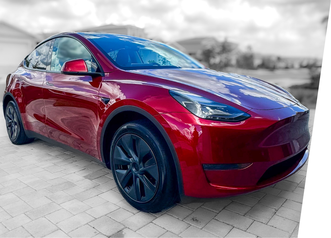 Freshly detailed, red Tesla Model Y showing extreme gloss