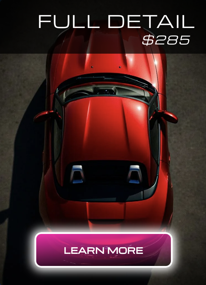 Top view of a red sports car with a black windshield and side mirrors on a dark surface with promotional text for a full detail service costing $285, and a pink and purple 'Learn More' button at the bottom.