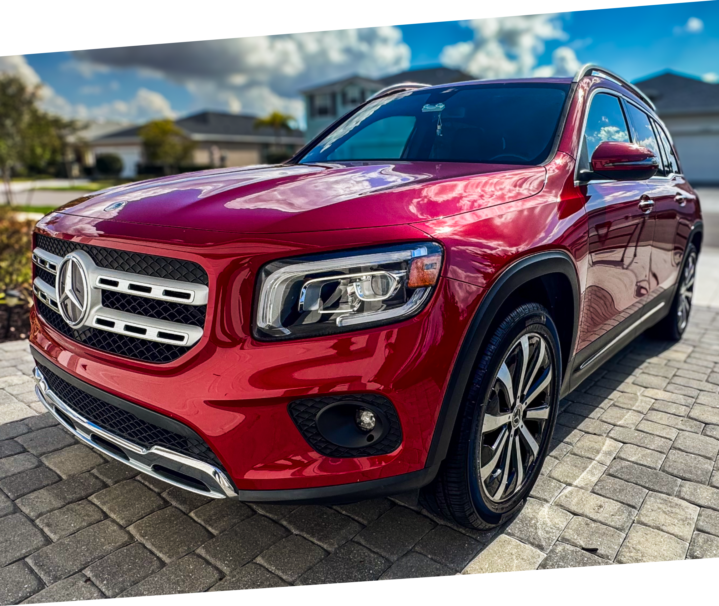 Red luxury Mercedes SUV with high gloss parked in a driveway after an exterior detail