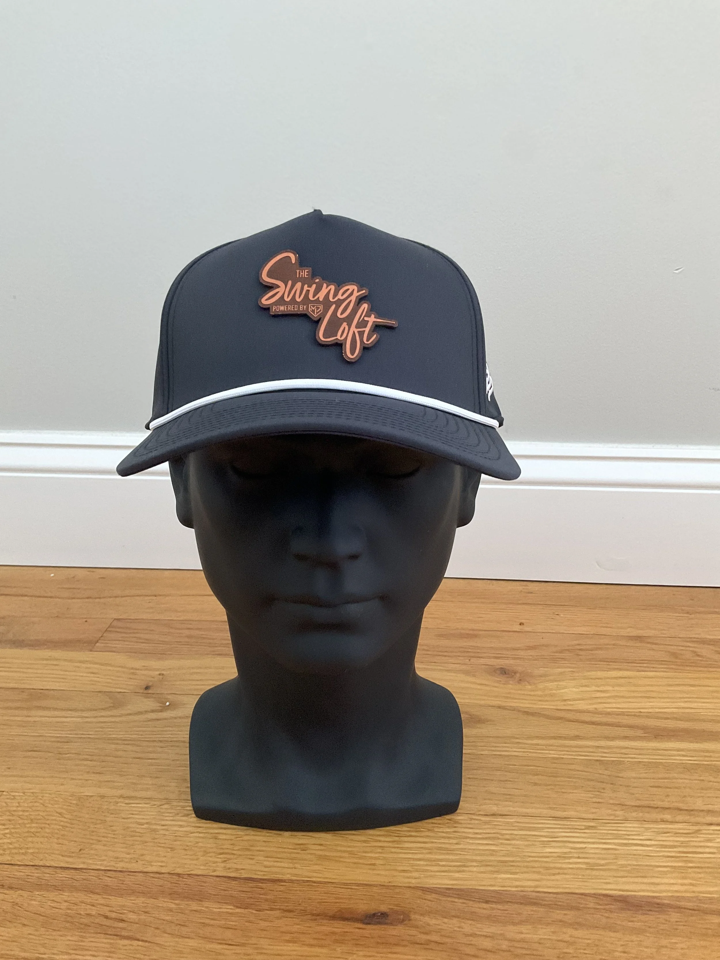 Black hat
White rope
Leather logo
Curved brim