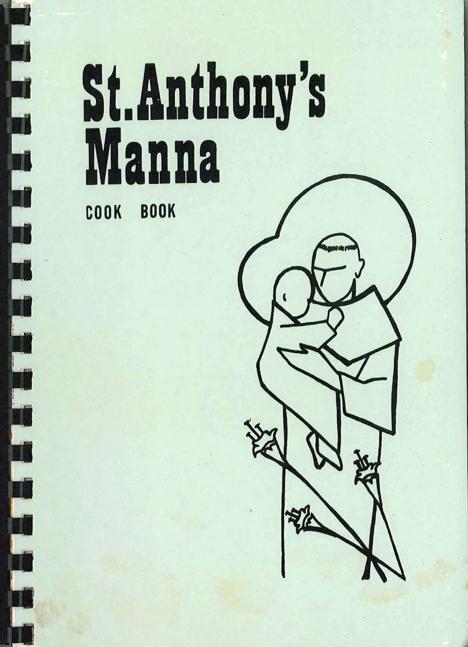 Cover of a cook book titled "St. Anthony's Manna" with a simple line drawing of a priest holding a cross and a child.