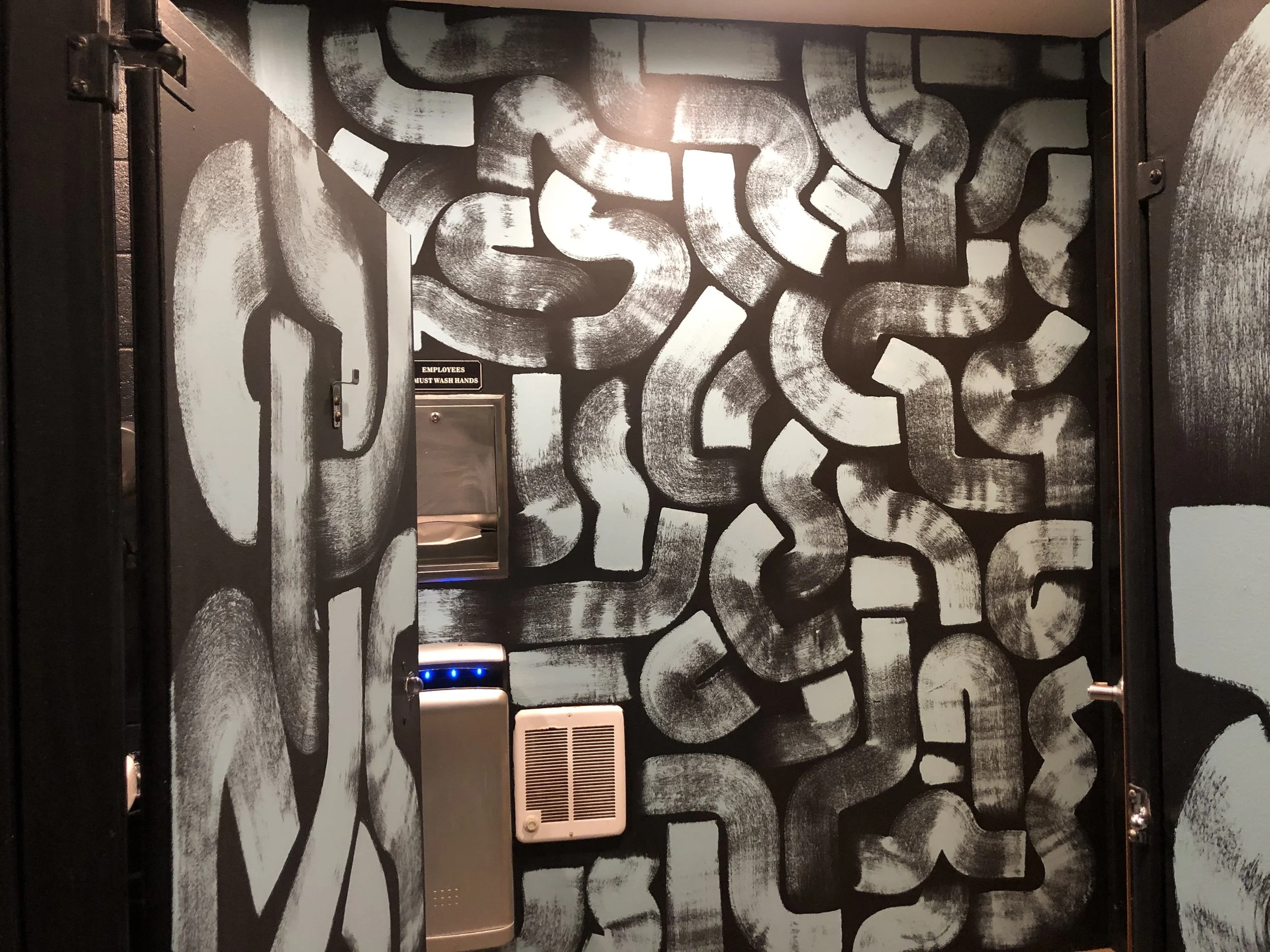 Hand Painted brush stroke design in bathrooms of Seventh Son Brewing