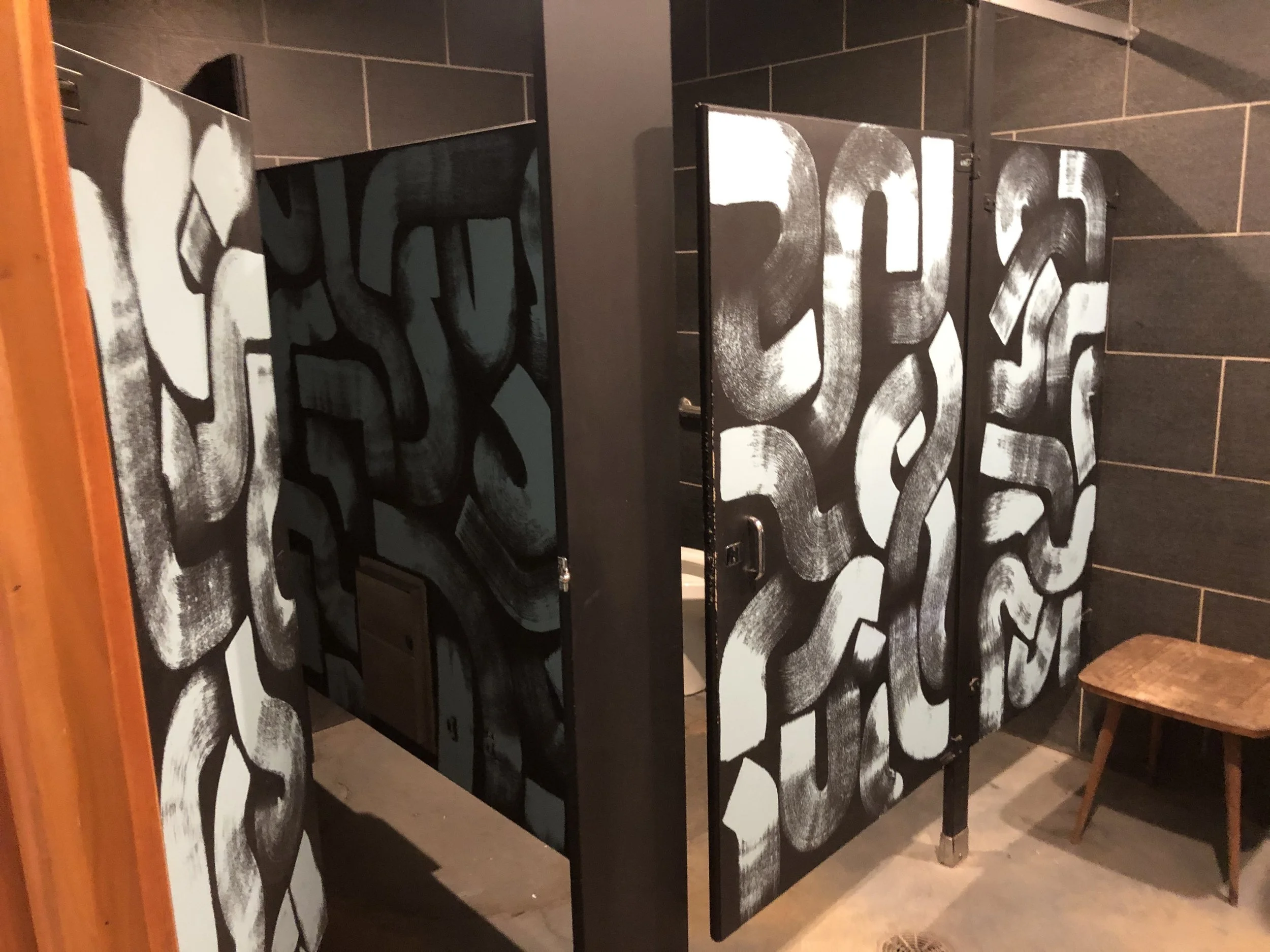 Hand Painted brush stroke design in bathrooms of Seventh Son Brewing