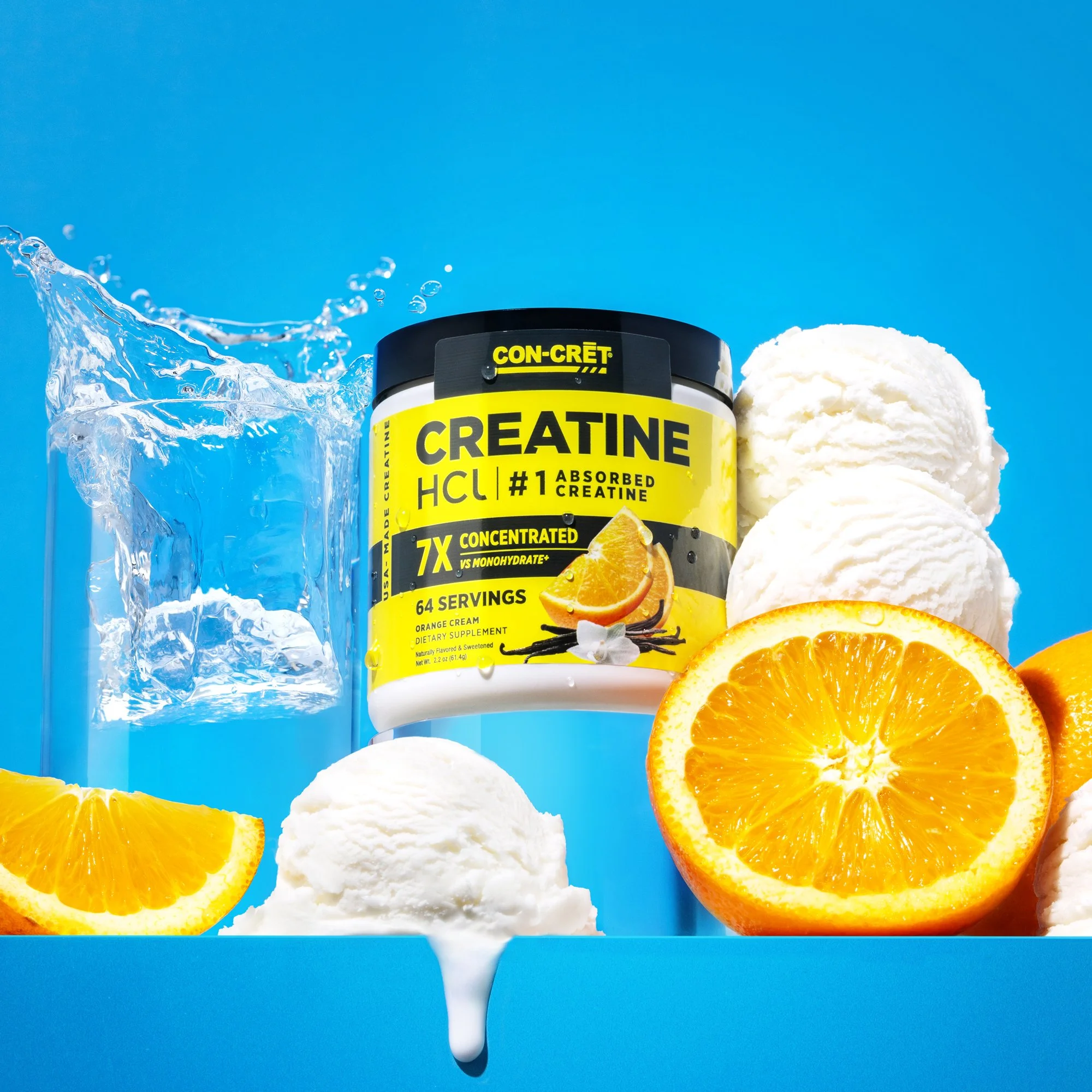 Container of creatine supplement with oranges, ice, and scoops of ice cream or whipped cream against a blue background. Eric Yu Photography Cara Dunning Art Direction