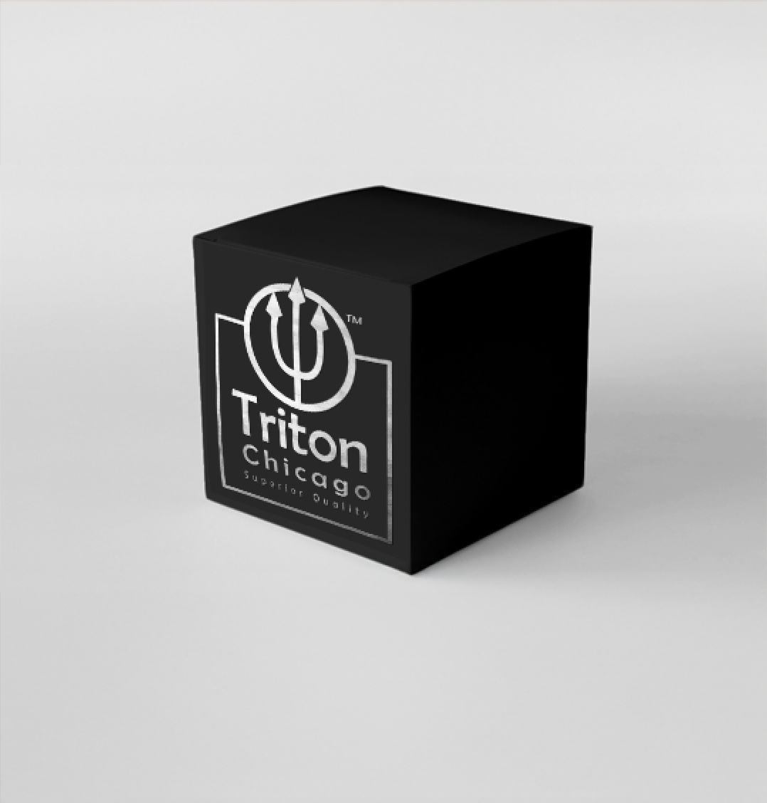 A black cube with the Triton Chicago logo on one side. The logo features a trident symbol and the text "Triton Chicago" with the tagline "Superior Quality." Cara Dunning Branding Design