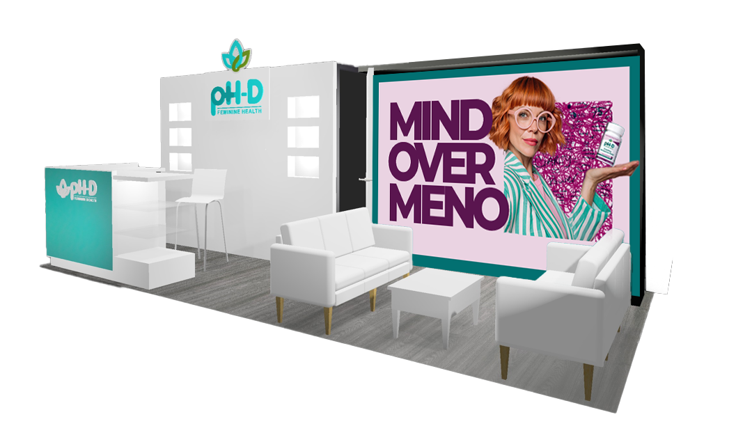 Trade show booth for OH-D Feminine Health featuring a seating area with white sofas and a large digital display with a woman holding a product and the text "Mind Over Meno".