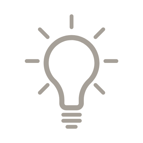 Outline of a light bulb with rays, symbolizing an idea or innovation.