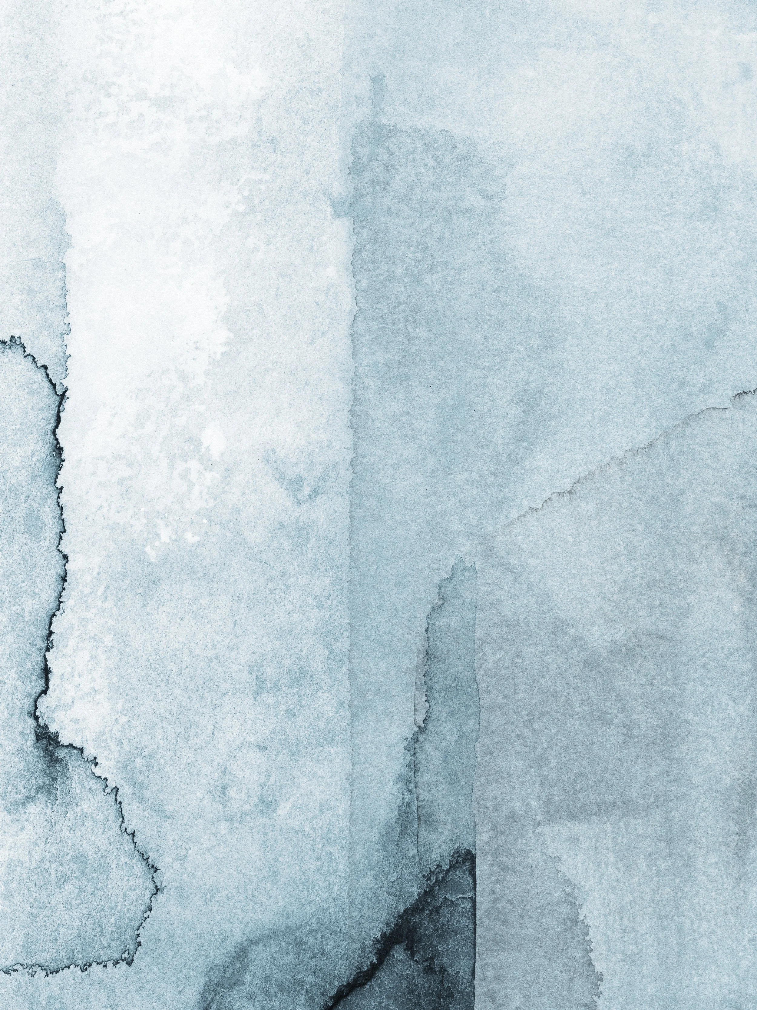 Abstract watercolor painting with shades of blue and gray, featuring textured and layered patterns.