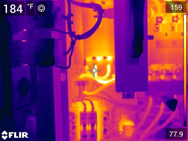 Thermal image of an electrical panel with various circuit boards, wires, and components emitting heat. Thermograpics. Thermograpy.  Unseen electrical problems. Hot wire. Hot contacts. Resistance at termination. Loose terminations.
