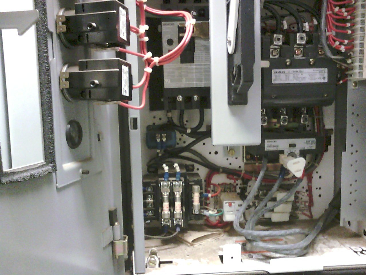 Interior of an electrical control panel with various wiring, circuit breakers, and electrical components. Thermograpics. Thermograpy.  Unseen electrical problems. Hot wire. Hot contacts. Resistance at termination. Loose terminations.
