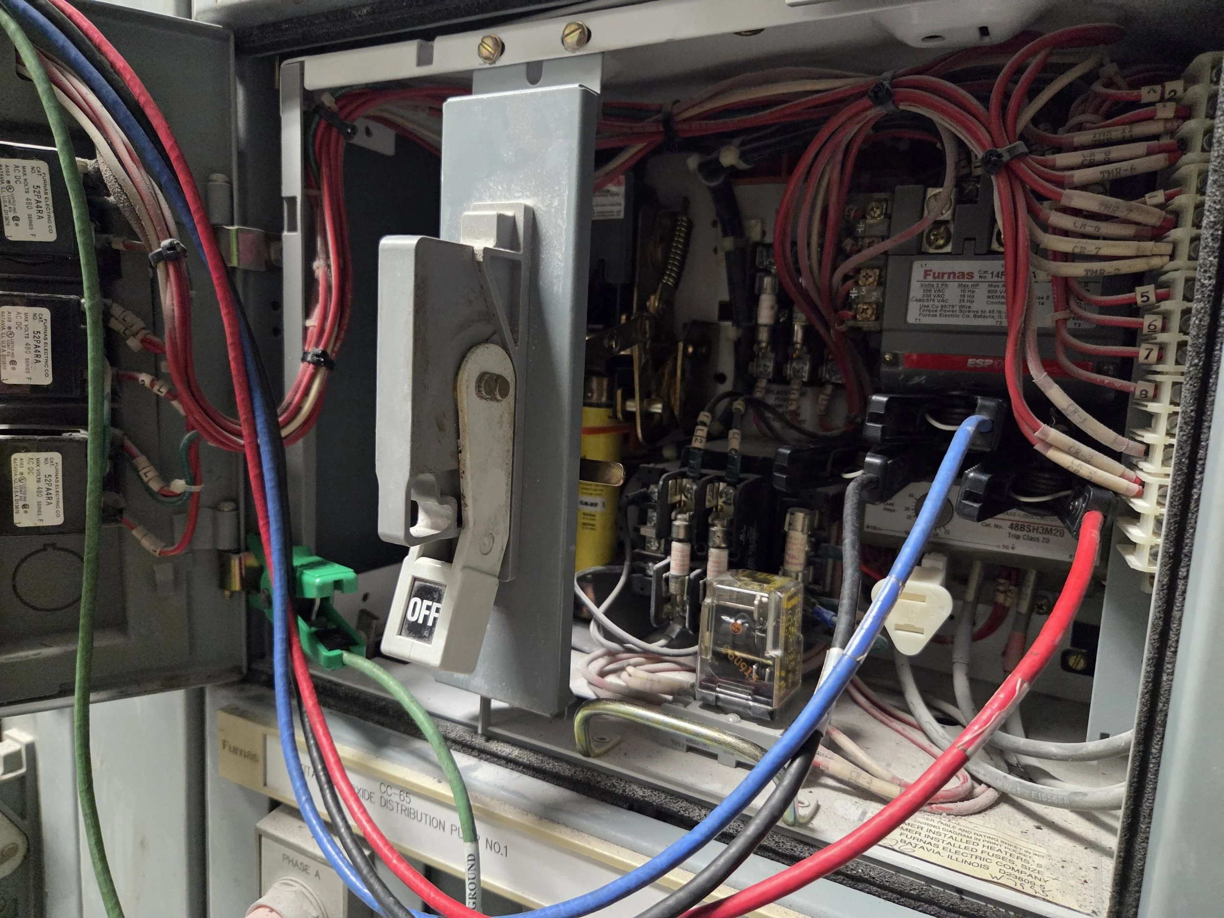 Interior of an electrical control panel with wires, relays, and circuit boards. MCC. Motor control center. Online motor testing. Non destructive motor testing. Reliabitlity