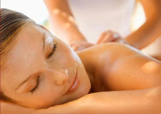 A woman is receiving a massage at a spa or wellness center.