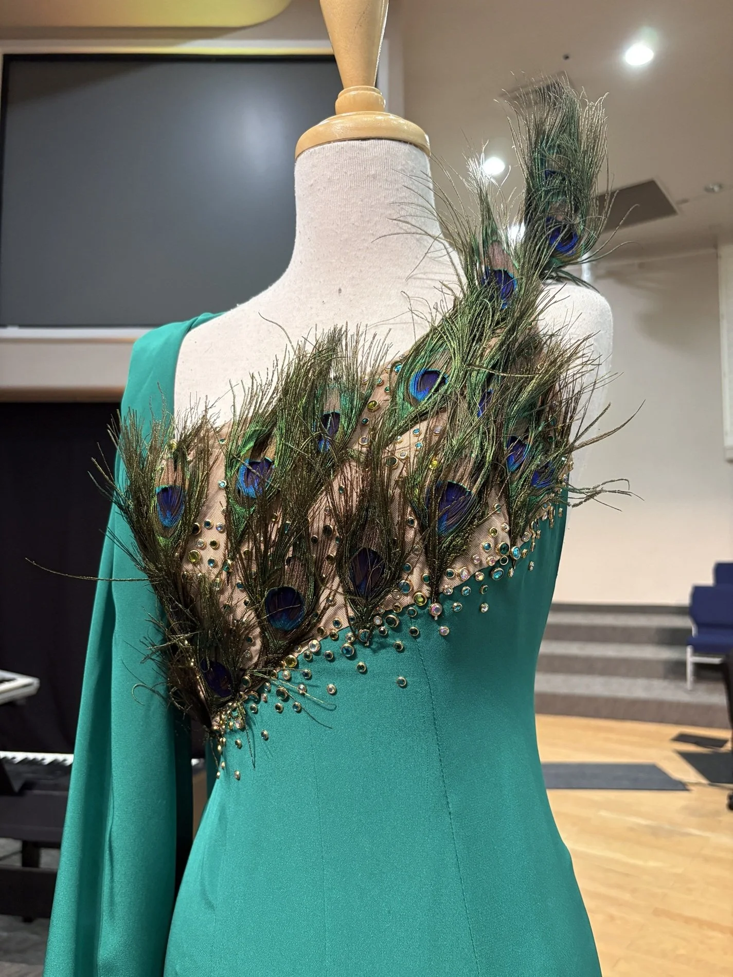 Peacock-inspired gown, created for actress McKenzie Westmore to wear at an NBC event. The design pays tribute to the iconic NBC Peacock logo.