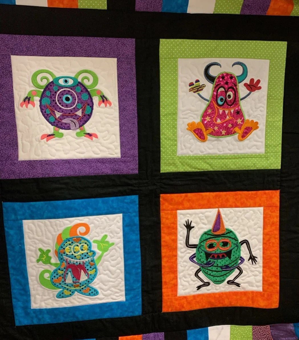 Quilting sample with four monsters
