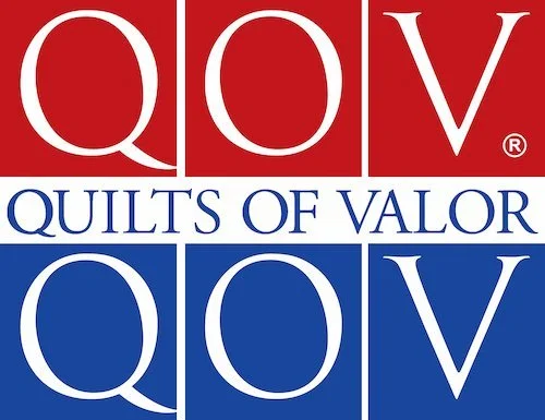 Logo with the letters 'QOV' in red and blue, and the phrase 'Quilts of Valor' in between.