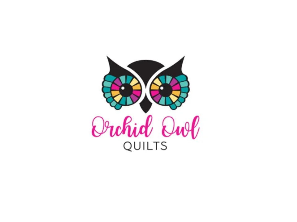 Logo for Orchid Owl Quilts featuring a stylized owl with colorful, stained-glass butterfly wings and pink and black text.