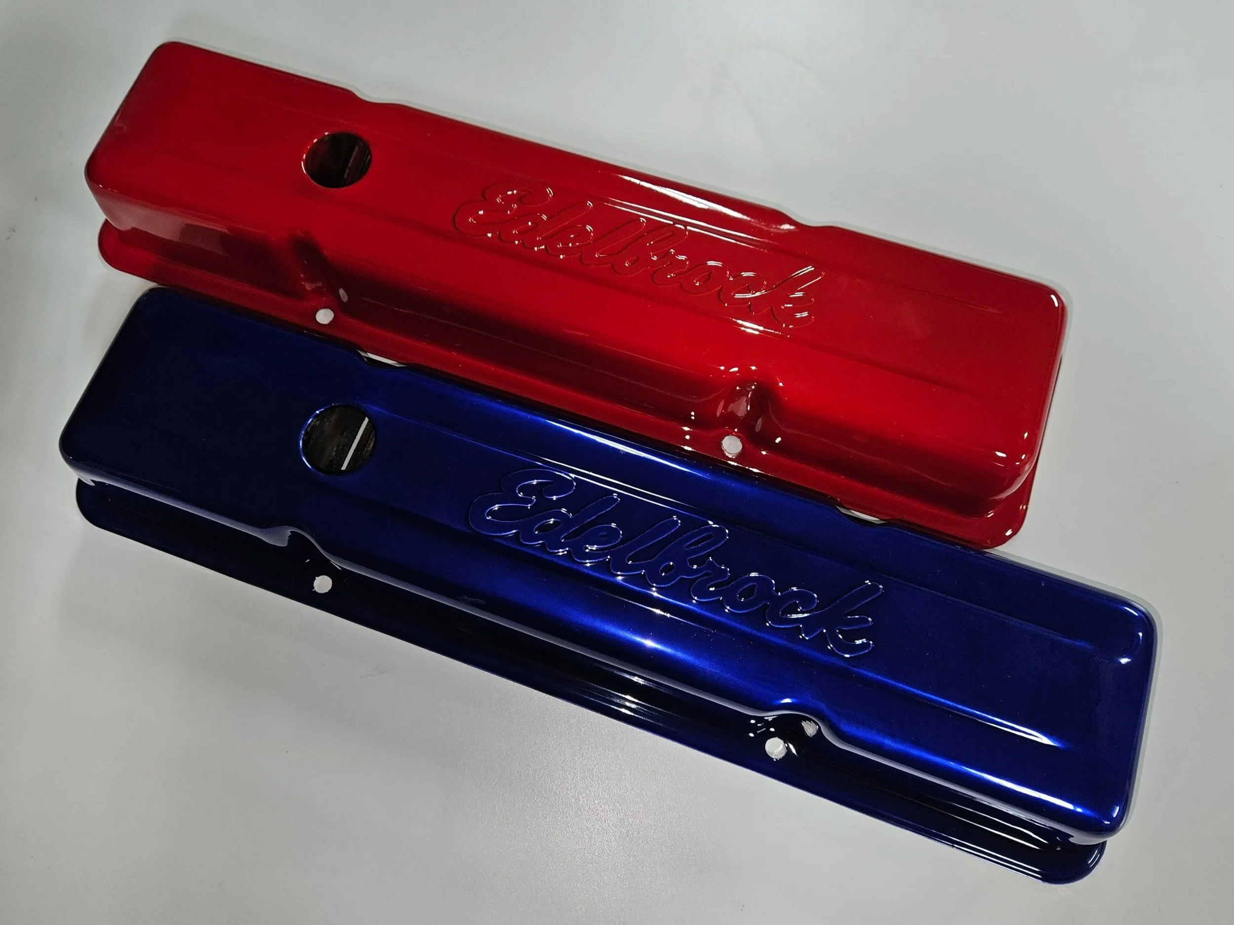 Red and blue Zippo lighters with