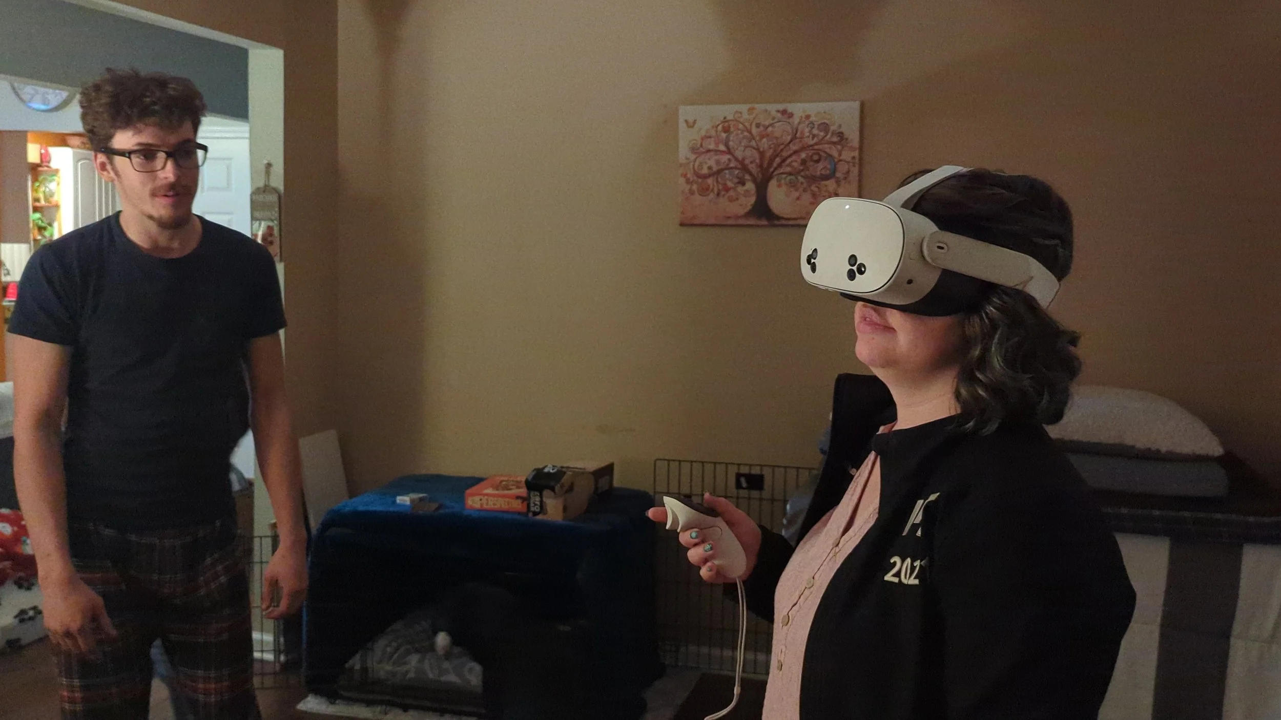Robert's Brother, Matthew, teaching Natasha to use a VR headset!